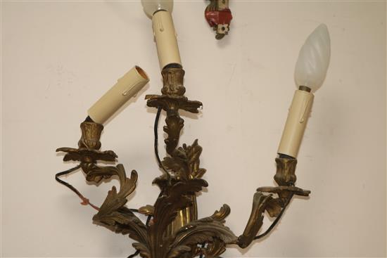 A pair of three branch ormolu wall lights length 55cm